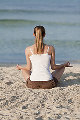 Image showing Woman doing yoga on the beach Sports Landscape