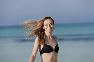 Image showing Young woman with bikini on the beach, laughing Portrait Landscap