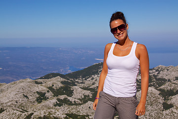 Image showing Smiling girl with panorama