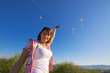 Image showing Smiling girl with kite