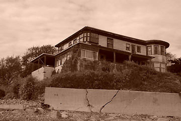 Image showing old abandoned beach house sepia