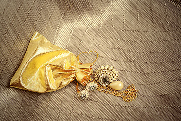 Image showing gold sack with vintage jewelry