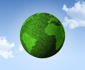 Image showing 3D green grass globe on a blue sky