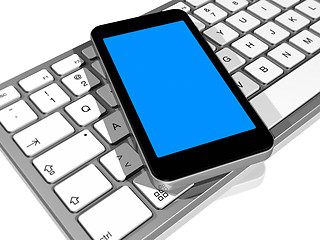 Image showing mobile phone on a computer keyboard