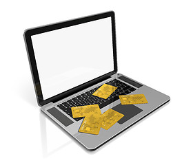 Image showing gold credit cards on laptop