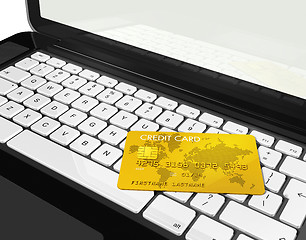 Image showing gold credit card on laptop