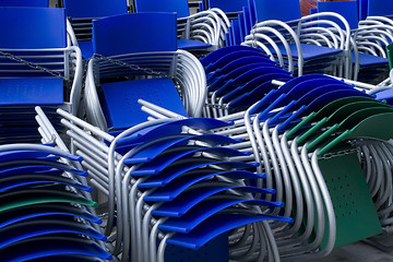 Image showing piled chairs outdoor