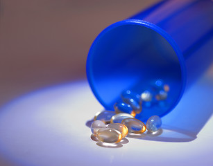 Image showing Blue Bottle with Gel Pills