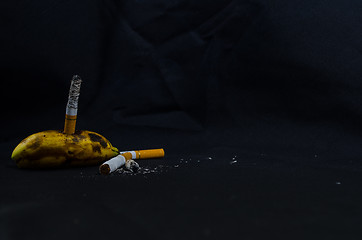 Image showing Rotten Banana with Cigarette
