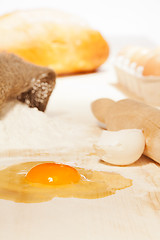 Image showing flour, egg on kitchen table