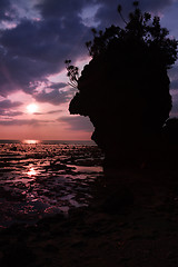 Image showing beautiful sunset sky with cliff silouette