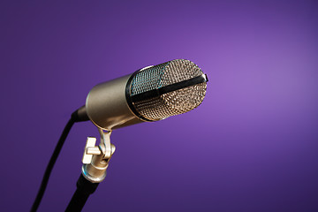 Image showing metallic microphone on purple