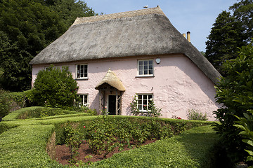 Image showing traditional pink painted english cottage