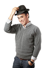 Image showing Smiling attractive young man wearing black hat