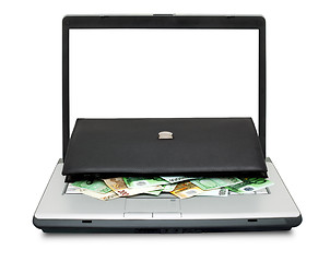 Image showing Open laptop with money