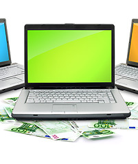 Image showing Open laptop with money 