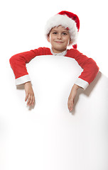 Image showing Boy holding a christmas poster 