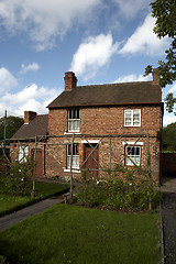 Image showing tilted cottage