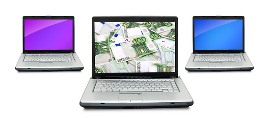 Image showing Open laptops with money 