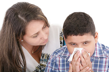 Image showing Child blowing nose. Child with tissue. catarrh or allergy 