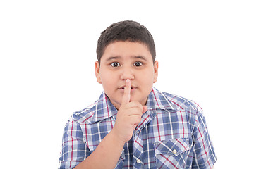 Image showing Portrait of beautiful little boy with silence gesture over white