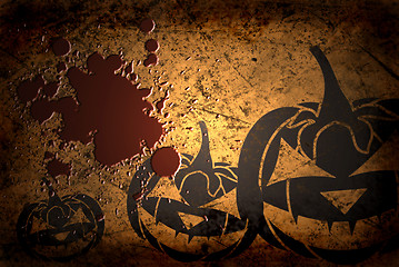 Image showing Scary Jack O Lantern halloween pumpkin on  grunge background with blood