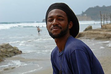 Image showing happy rasta-man on the beach of pacific ocean