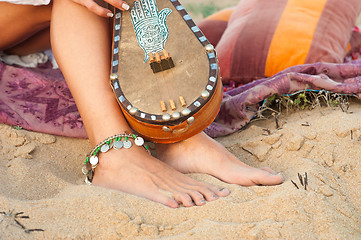 Image showing Bare feet on sand