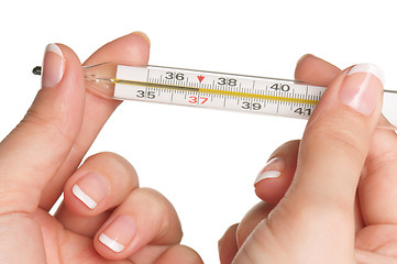 Image showing Hand with thermometer