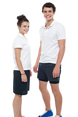 Image showing Teen couple in sportswear posing casually