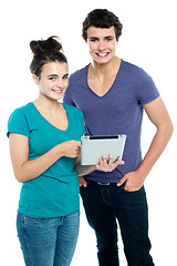 Image showing Technology savvy couple browsing newly launched tablet