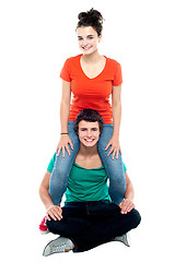 Image showing Girl riding on her boyfriend's shoulder
