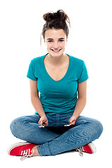 Image showing Charming teenager posing with tablet pc in hands