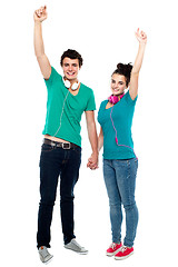 Image showing Strong bonding of cheerful teen couple enjoying music