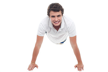 Image showing Active sports guy doing push ups