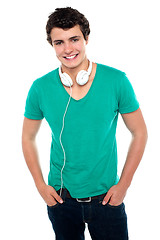 Image showing Cool trendy teenager boy with headphones around his neck