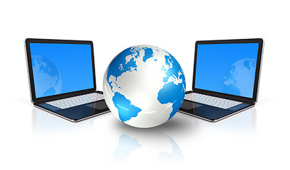 Image showing two Laptop computers around a world globe