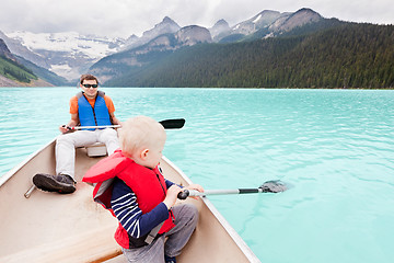 Image showing father and son on a lake
