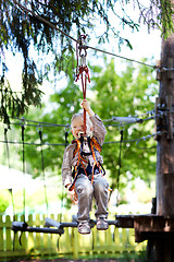 Image showing little boy ziplining