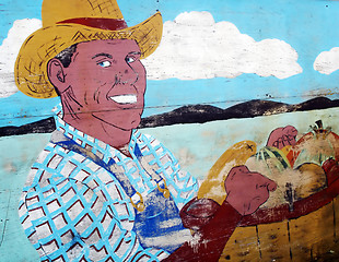 Image showing Man carrying basket of apples - EDITORIAL