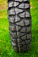 Image showing Tire at green grass