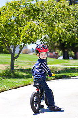 Image showing toddler on a balance bike