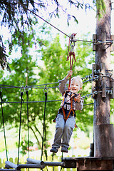 Image showing little boy ziplining