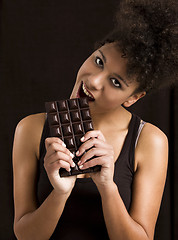 Image showing Woman eating chcolate