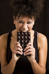 Image showing Woman eating chcolate