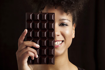 Image showing Woman with a chocolate bar