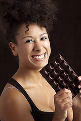 Image showing Woman with a chocolate bar