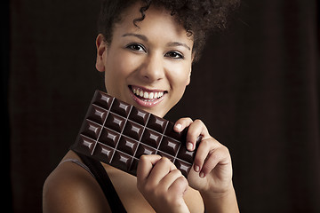 Image showing Woman with a chocolate bar