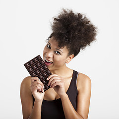 Image showing Woman eating chcolate