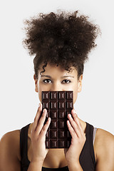 Image showing Woman with a chocolate bar